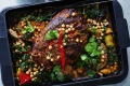 慢炖猪肩肉和根芹配炖鹰嘴豆和银甜菜。